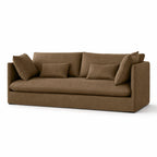 Nella slipcover sofa in mocha linen featuring a relaxed low-set silhouette, generous loose cushions, and a tailored 100% linen cover.