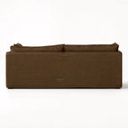 Back view of Nella Mocha Linen Slipcover Sofa featuring a low-set silhouette, loose cushions, and tailored 100% linen fabric.