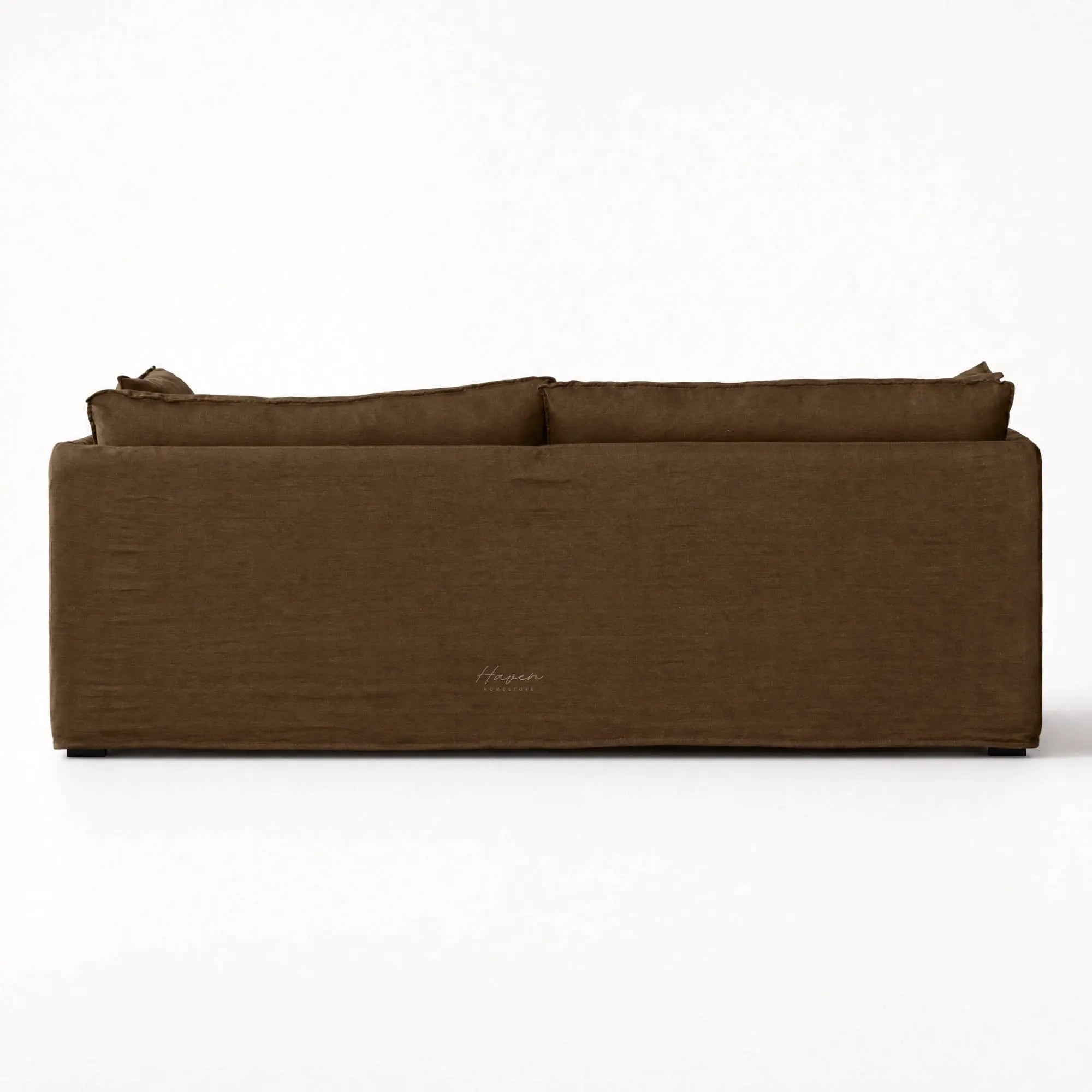 Back view of Nella Mocha Linen Slipcover Sofa featuring a low-set silhouette, loose cushions, and tailored 100% linen fabric.