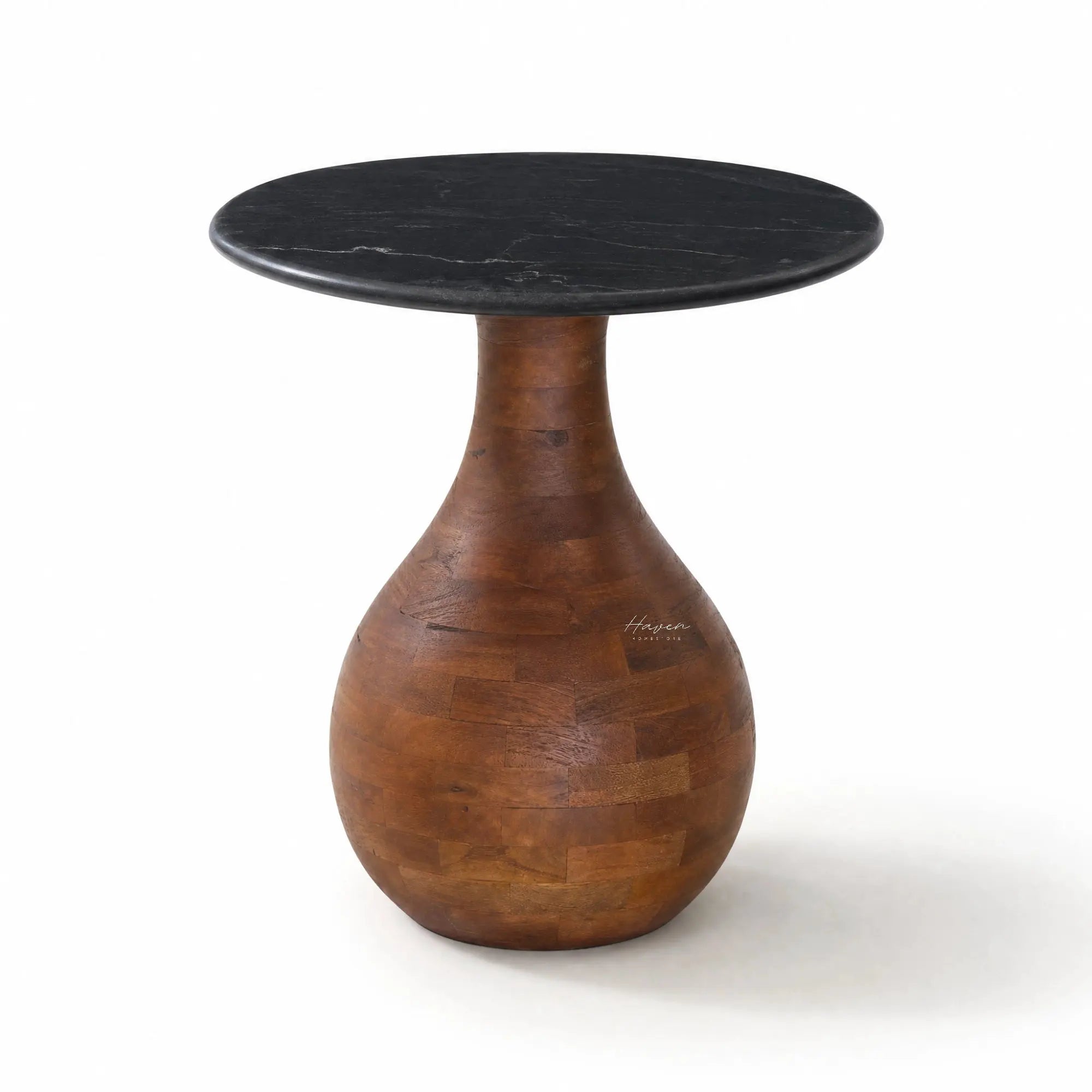 Sculptural side table with a black marble top and rounded mango wood pedestal base featuring an organic, tapering silhouette.