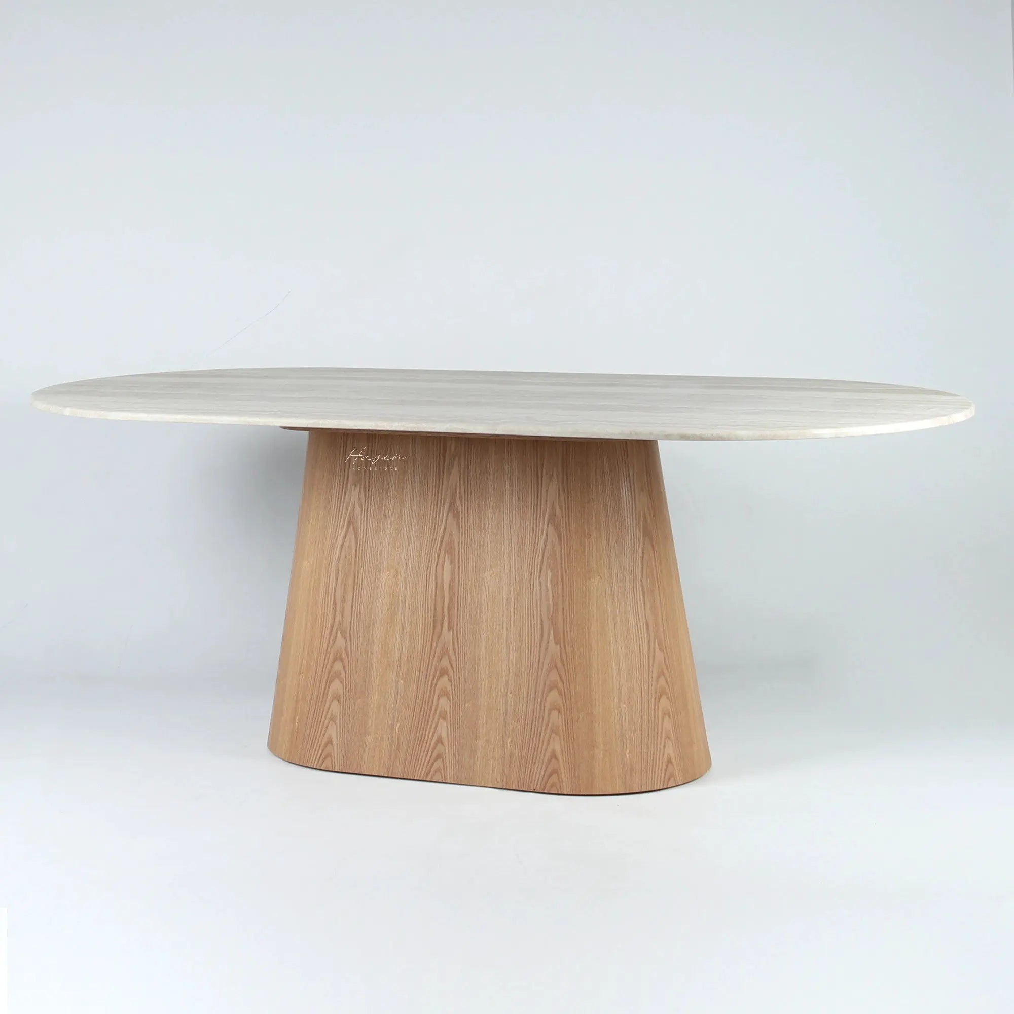 Oval faux marble dining table with a tapered wooden pedestal base, featuring a modernist sculptural silhouette.