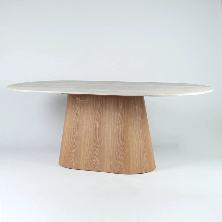Oval faux marble dining table with a tapered wooden pedestal base, featuring a modernist sculptural silhouette.
