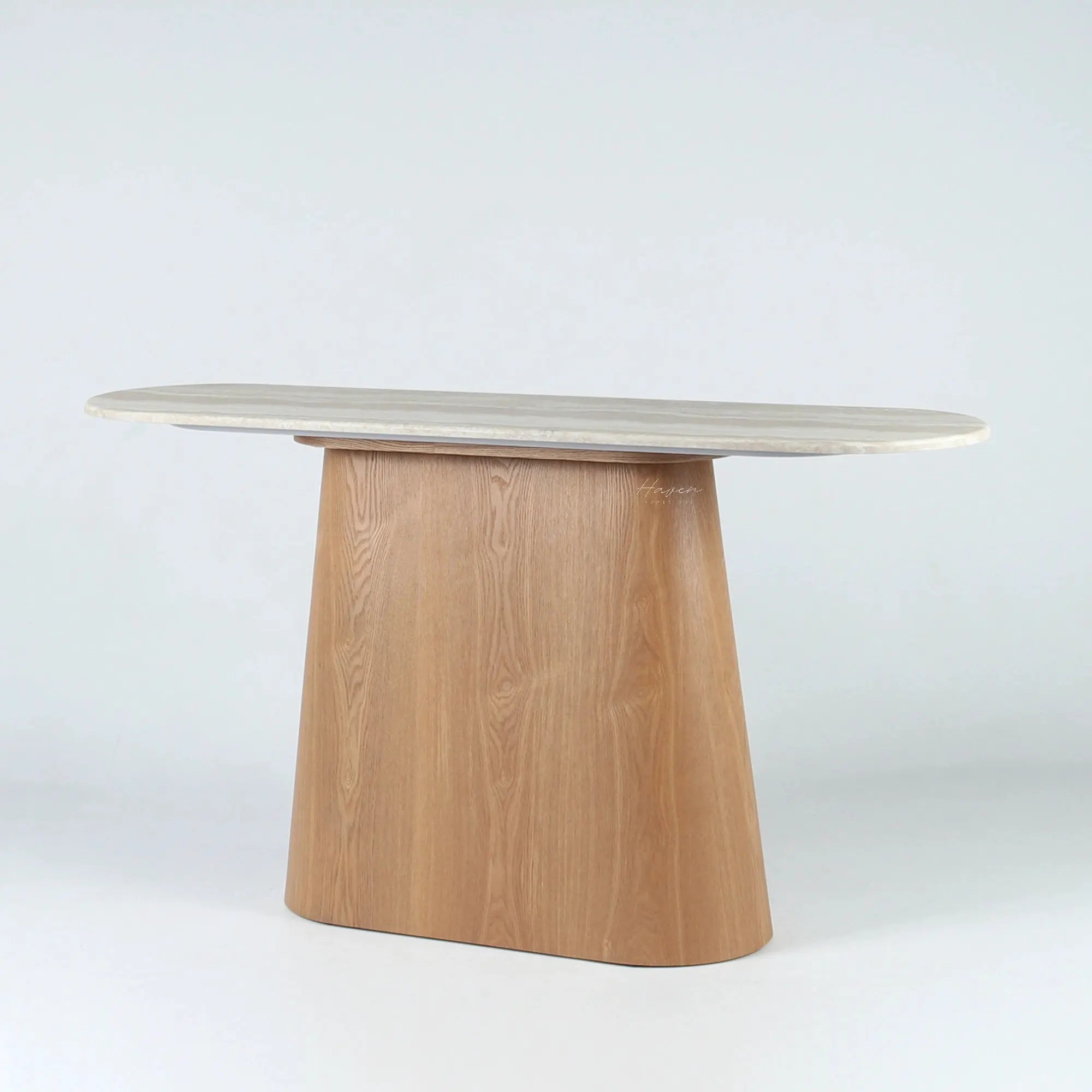 Elongated console with rounded faux marble top and tapered oak veneer pedestal, creating a quiet arch contrast.