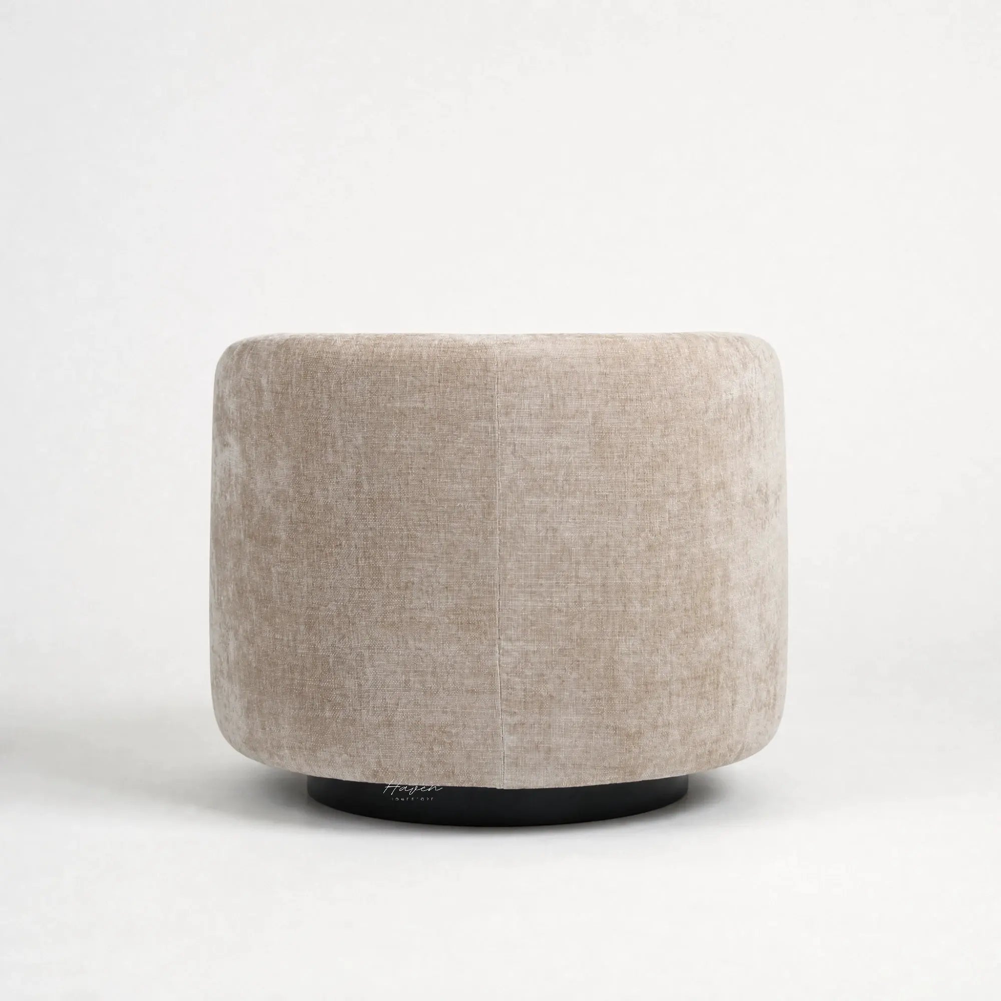 Oatmeal swivel chair with a rounded, sculptural profile, textured upholstery, and a discreet dark base.