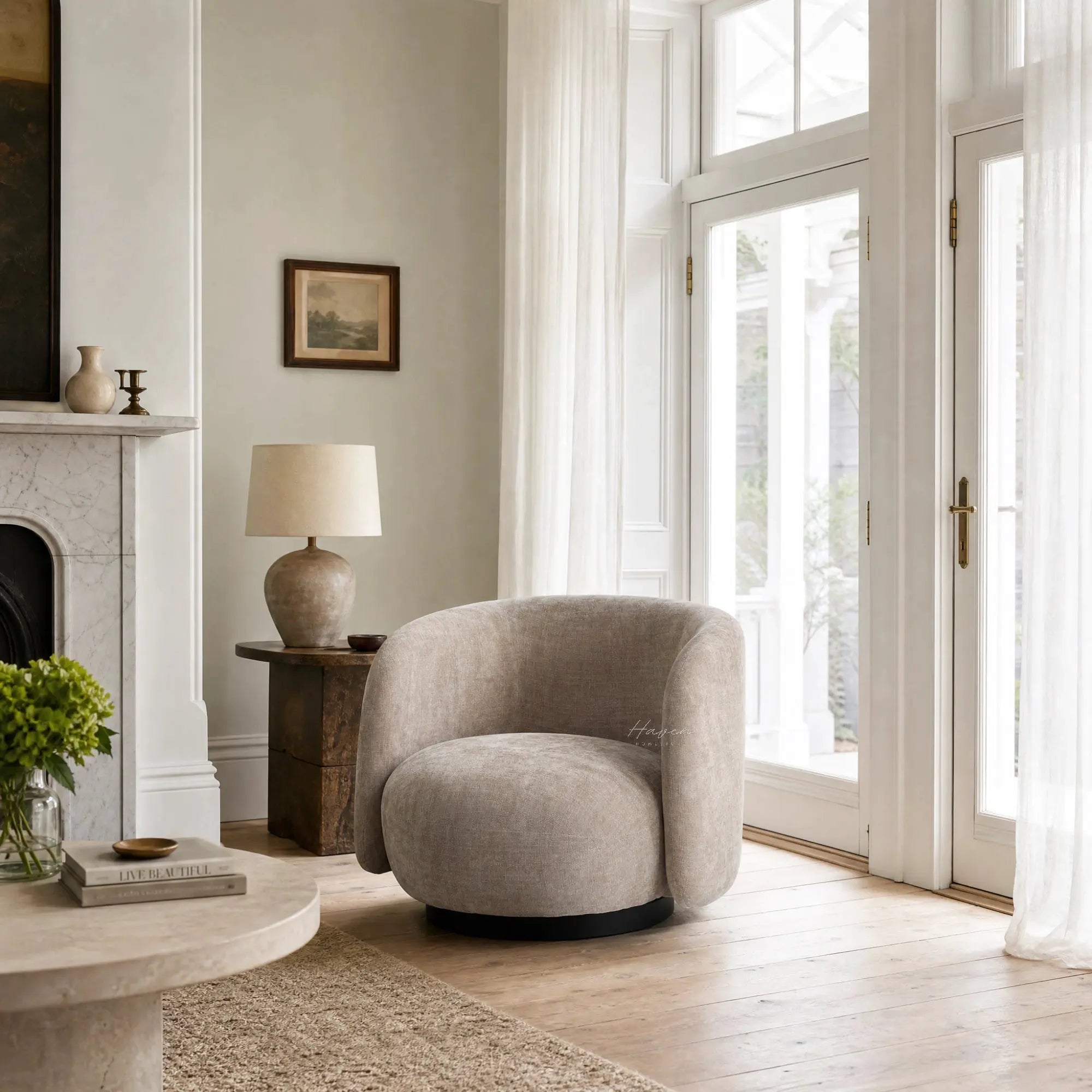 Oatmeal swivel chair with rounded profile and textured fabric, grounded by a dark base in a sunlit living room.
