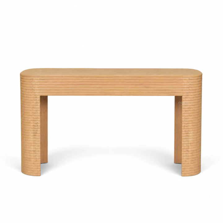Elva Console in mindi timber with softly rounded silhouette and horizontal carved detailing.