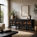 Kado sideboard with dark timber finish, rounded glass doors, and warm ash interior accents in a sunlit living room.