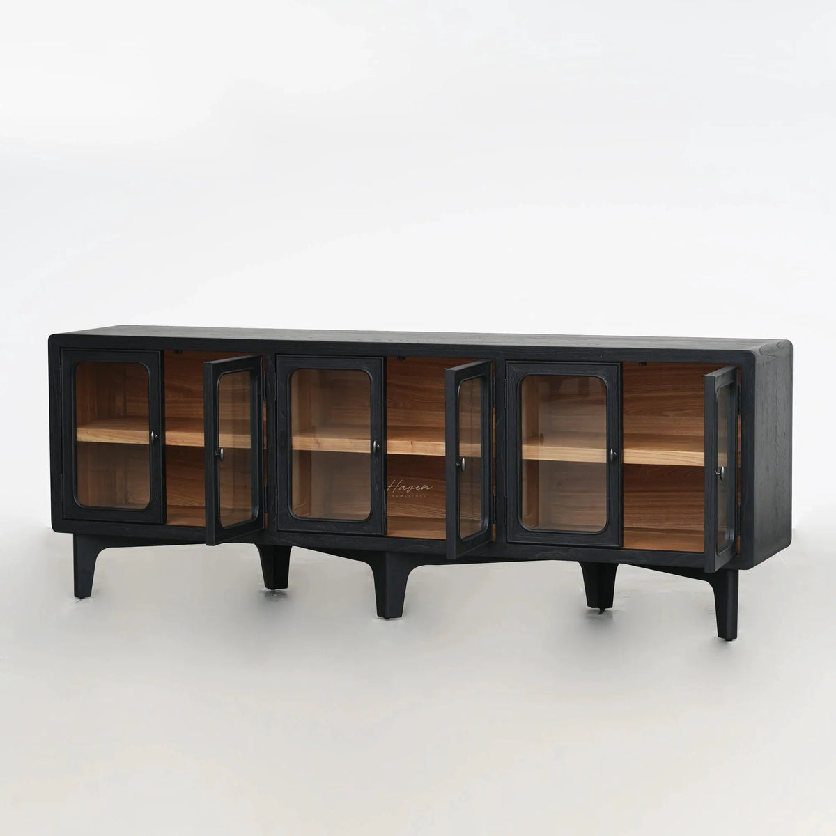 Long, low profile dark timber sideboard with rounded glass doors open to reveal warm ash wood interior shelving.