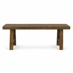 Reclaimed elm Estuary Bench featuring a broad seat, substantial legs, and a softly irregular surface with visible knots and grain.