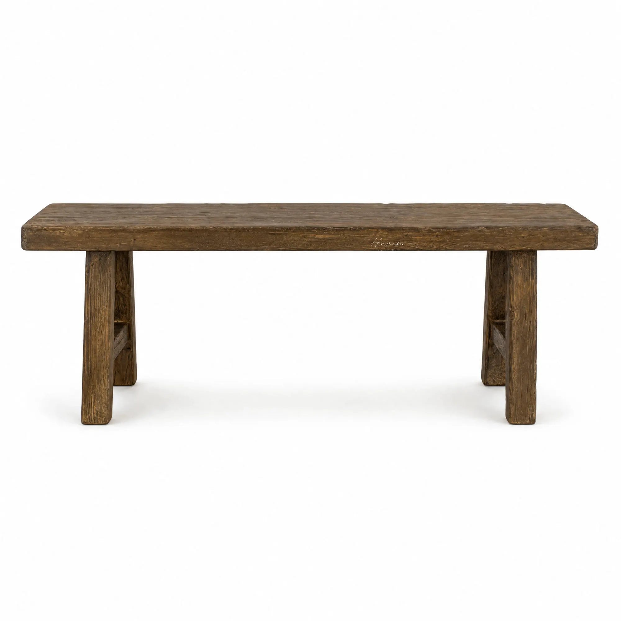 Reclaimed elm Estuary Bench featuring a broad seat, substantial legs, and a softly irregular surface with visible knots and grain.