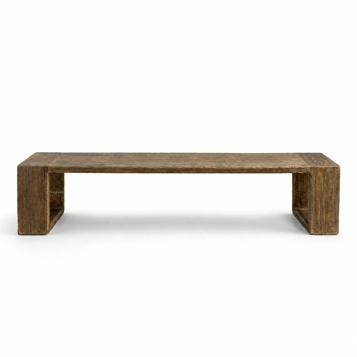 Long reclaimed elm dining bench with substantial block supports, displaying raw texture, natural grain, and irregular surface details.