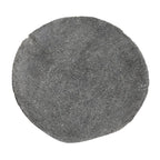 Riverstone plate with organic irregular edge and textured gray surface. Sculptural stone dinnerware with natural elemental character.