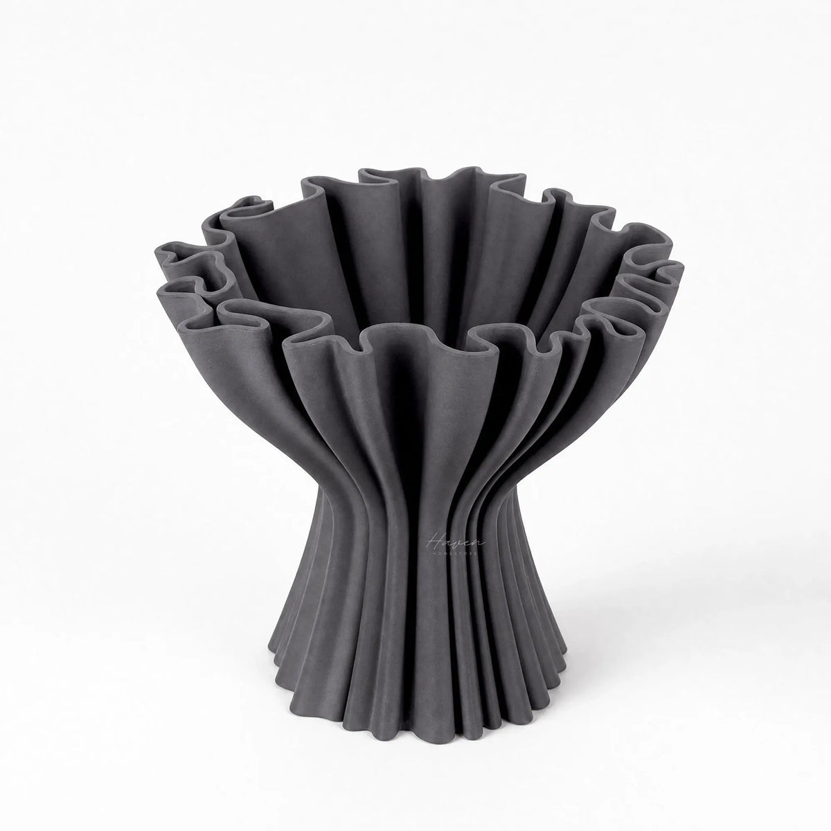 Sculptural grey compote vase featuring a rhythmic pleated form and softly flared silhouette with a layered 3D printed ceramic texture.