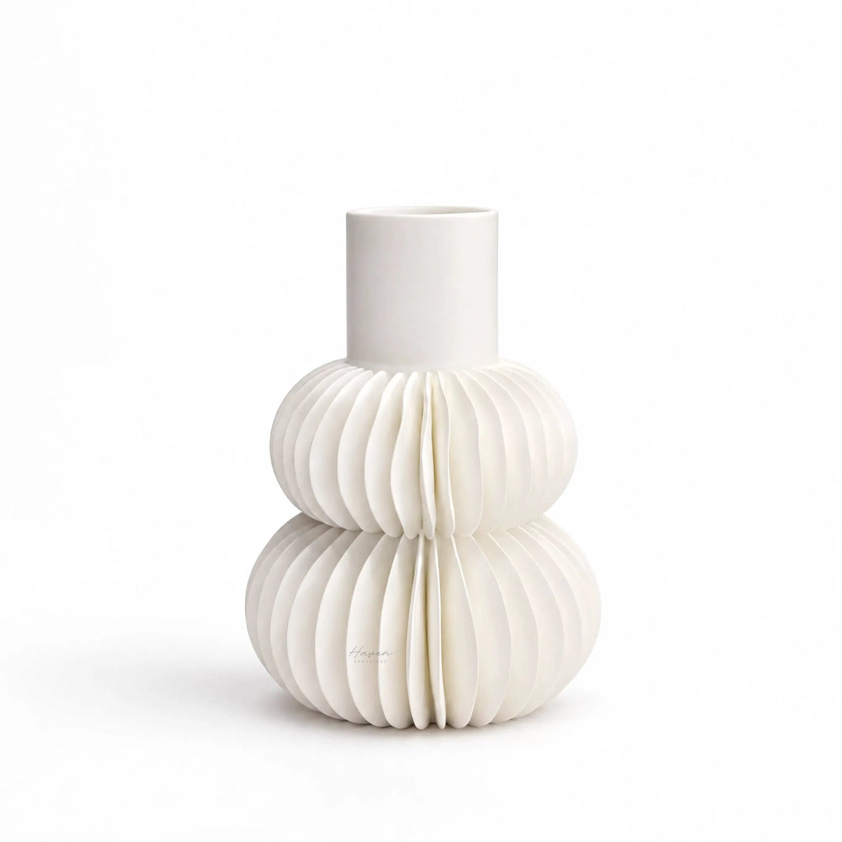 White bone china vase with sculptural tiered pleating, featuring two rounded volumes and a cylindrical neck.
