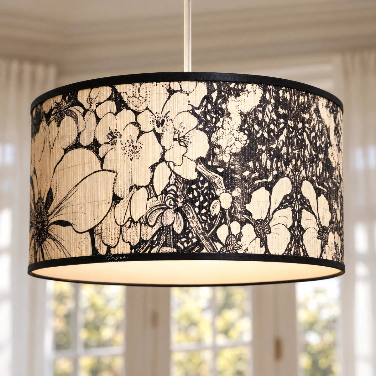 Drum pendant lightshade with textured bamboo finish and expressive black botanical floral motif, featuring a slim black metal rim.