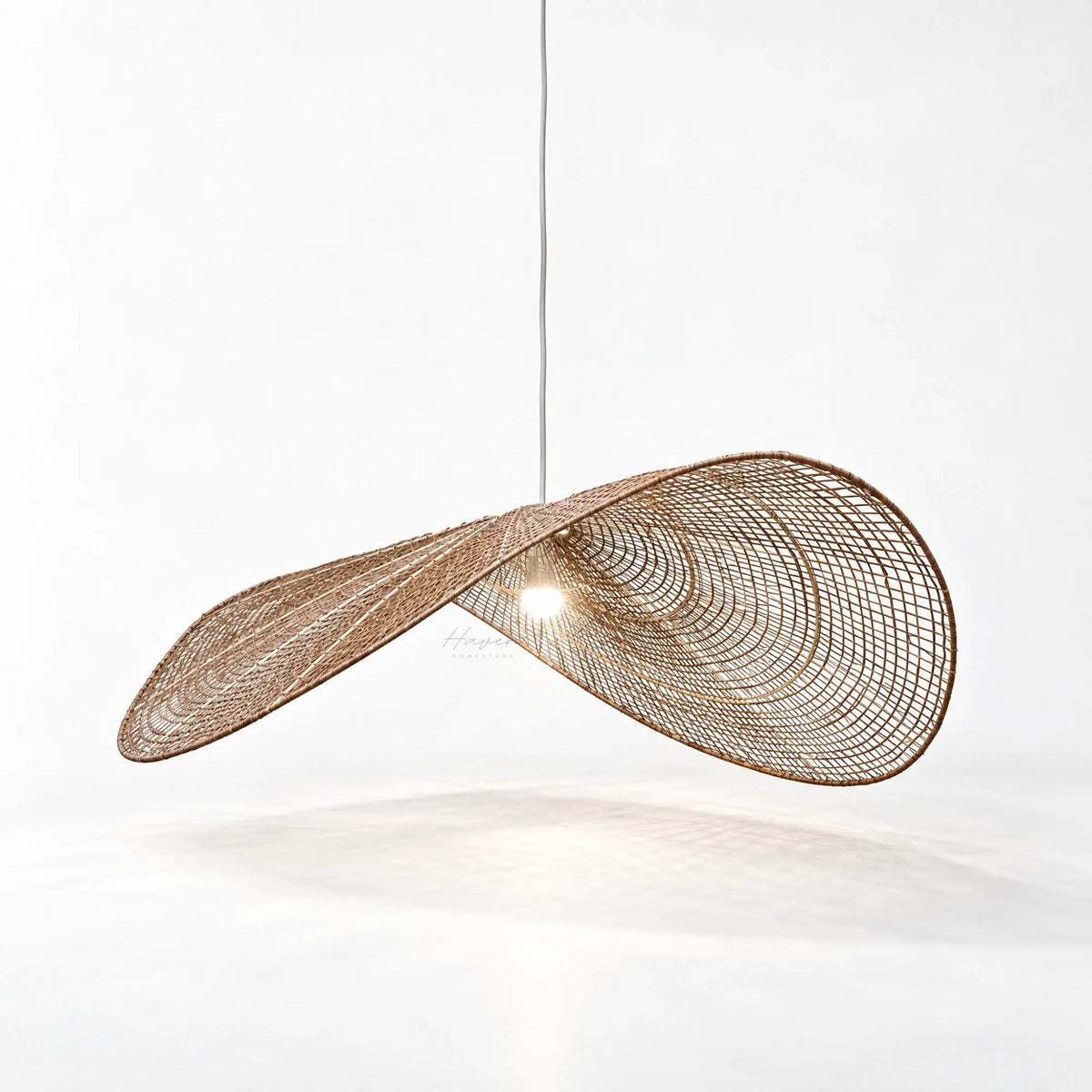 Sweeping wing-like hanging lightshade crafted from handwoven natural jute over a metal frame, featuring an open textured weave and broad 1100mm span.