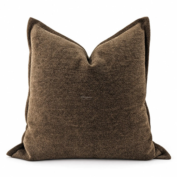 Softly textured cocoa cushion cover with subtle tonal variation and relaxed square shape.