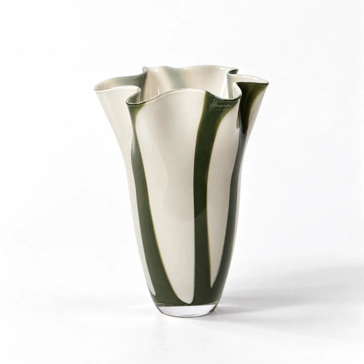 Mouthblown glass vase featuring vertical hunter green and cream white stripes with a fluid, undulating ruffled rim.