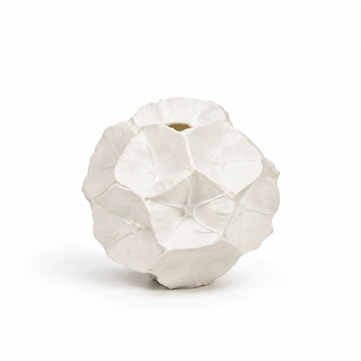 White bone china star studded seed pod vase with rounded organic form and overlapping petal-like impressions.