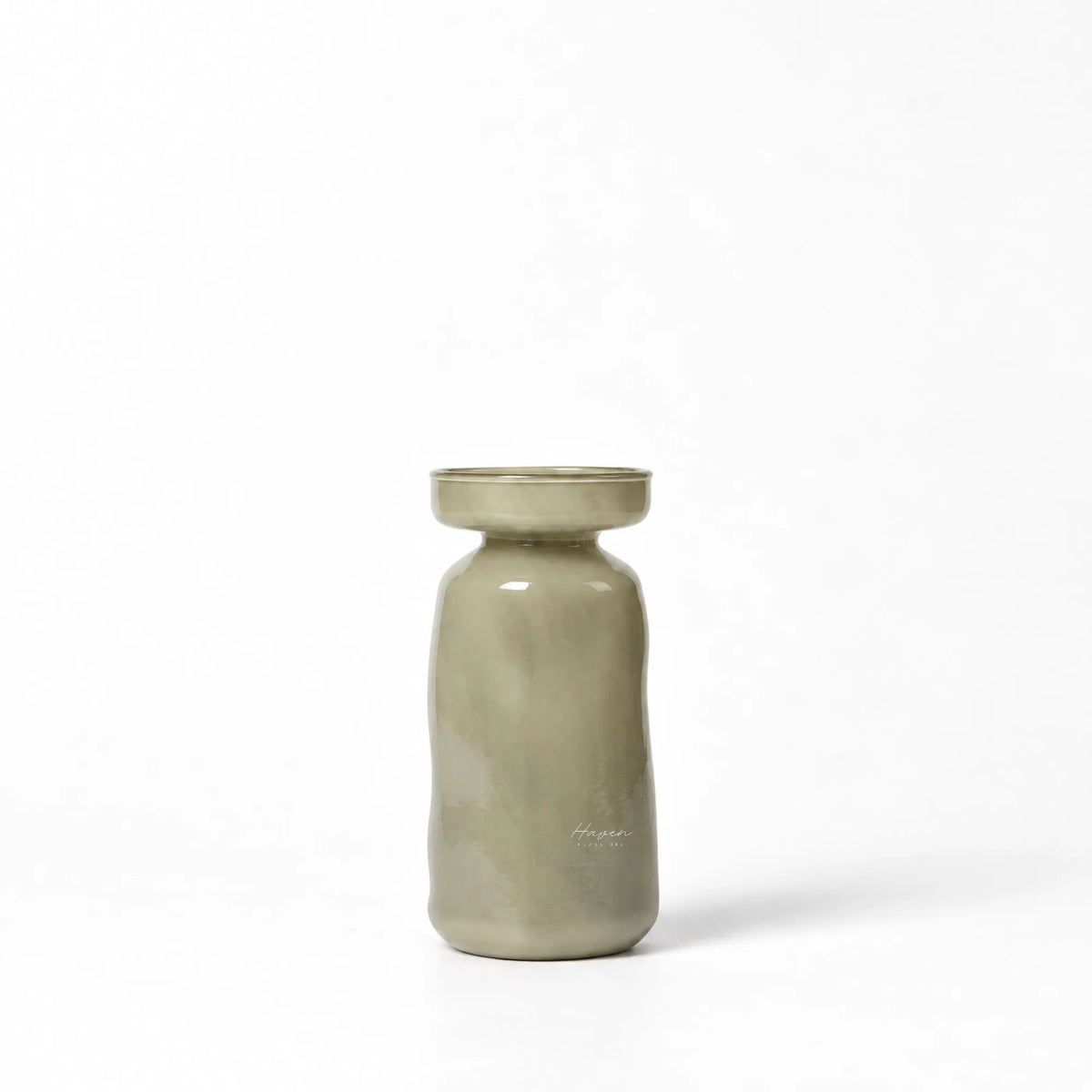 Mouthblown light green glass vase with a softly rounded silhouette, gently flared mouth, and muted translucency.