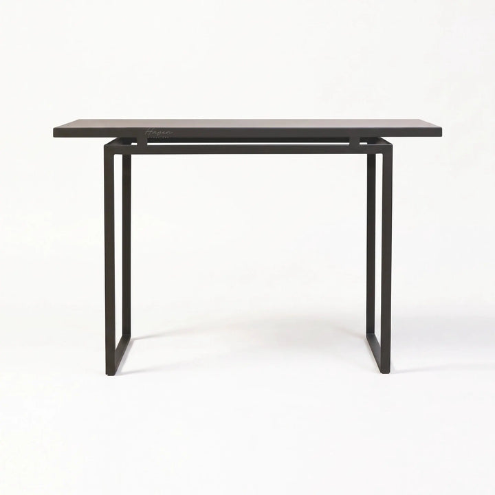 Modern greyed-brown console table with slim metal profile and open base frame for understated architectural entryway decor.