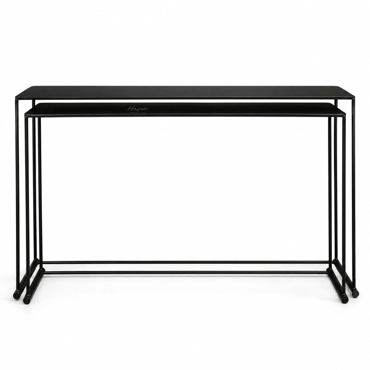 Black nesting console set with fine metal lines and elongated proportions, creating a layered architectural composition.