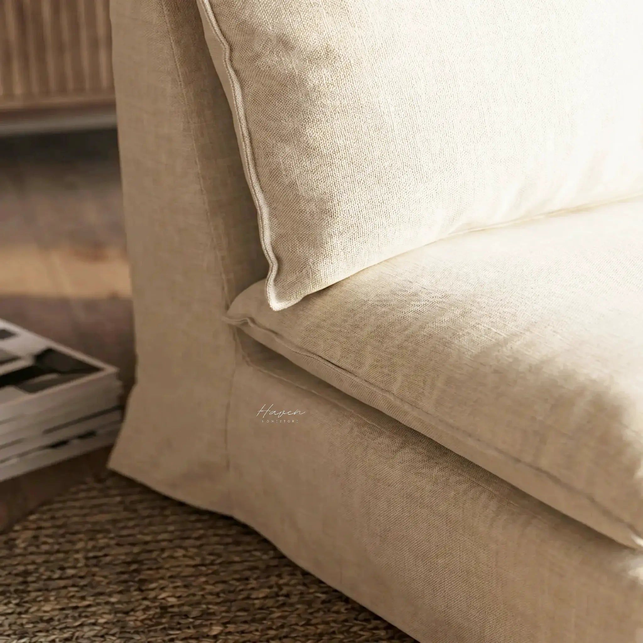 Lotus Club Chair in beige linen–polyester blend with a piped seam, close-up of plush upholstery.