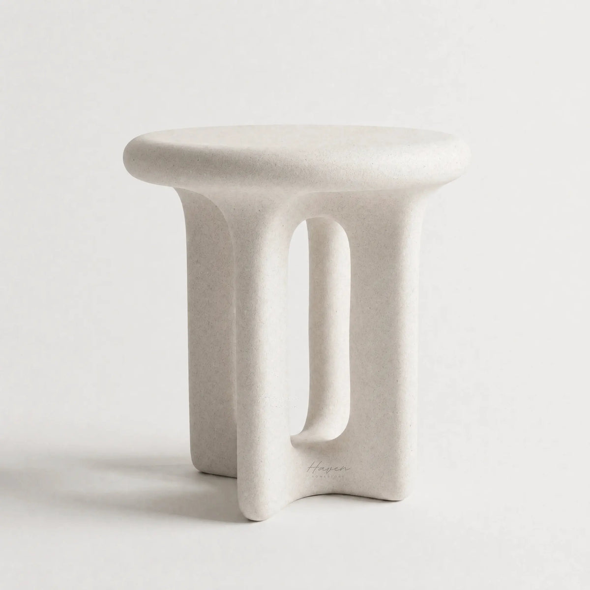 Yepa End Table with sculptural, curved form and architectural cut-out in matte linen GRC with stone-like texture.