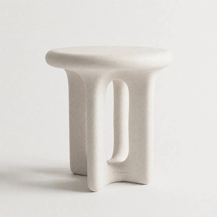 Yepa End Table with sculptural, curved form and architectural cut-out in matte linen GRC with stone-like texture.