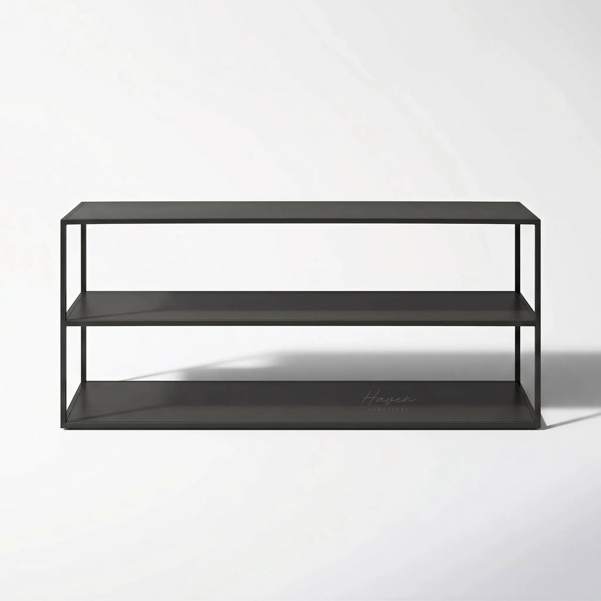 Studio Ellis Shelf: sleek black metal frame with open, low-profile shelves.