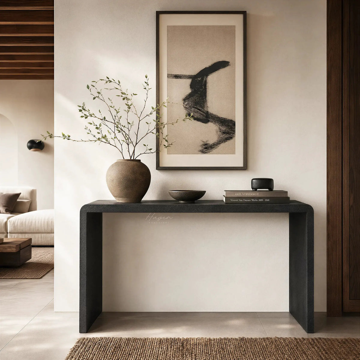 Clarence Waterfall Console in burnt wood resin finish with a vase and abstract brushstroke art in a serene living room