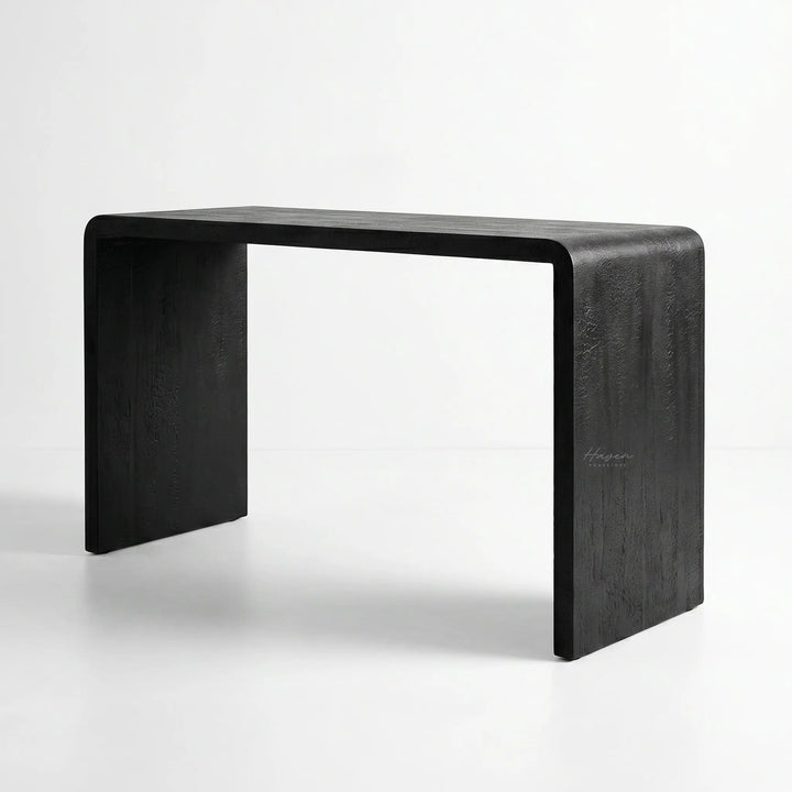 Clarence Waterfall Console with burnt wood resin finish and continuous waterfall silhouette in a modern home