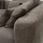 Haven Chaise Sofa Brownie close-up of soft fabric cushions and sculpted curves.