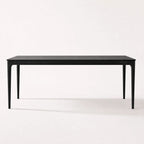 Baur Dining Table Black with solid North American ash, clean refined profile, natural grain visible.