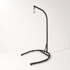 Black metal Pod Chair Stand with curved base, sturdy indoor/outdoor support for Haven Pod chairs.