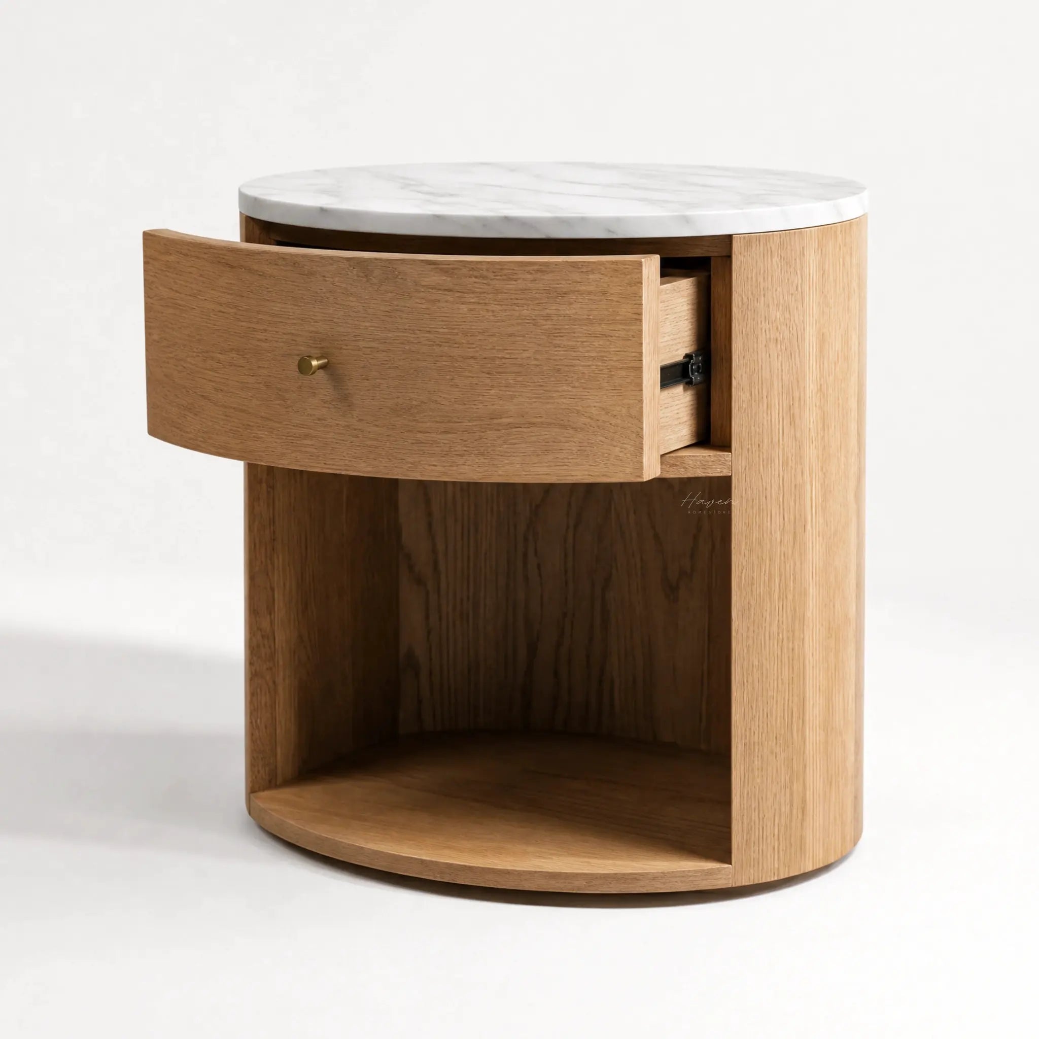 Dana Bedside Table with a white marble top, rounded oak body, curved concealed drawer and open lower shelf.