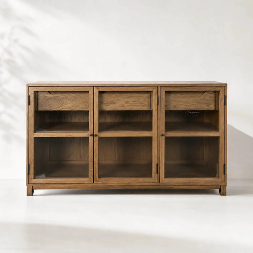 Baxter Oak Sideboard in warm oak veneer with glass-front doors and ample display and storage.
