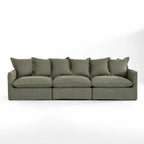 Lotus Modular Sofa Left in olive-green linen with soft plush cushions.