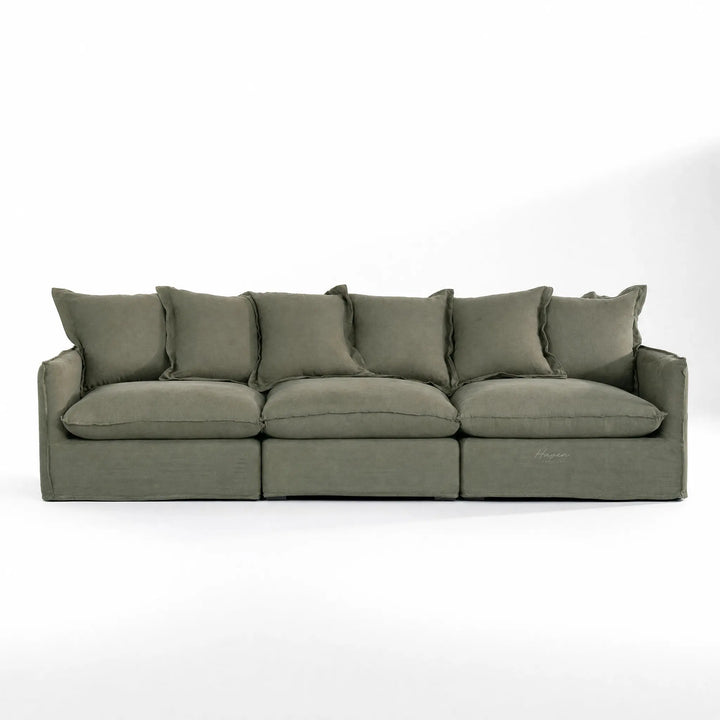 Lotus Modular Sofa Left in olive-green linen with soft plush cushions.