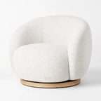 Palmetto Swivel Chair with cocoon-like rounded silhouette in textured fabric and wooden base