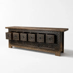 Nomad Coffer Blackened: reclaimed pine chest with diamond-pattern drawers, rich texture and moody warmth.