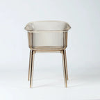 Translucent amber polycarbonate chair with sculptural wraparound silhouette and fine vertical detailing on back and seat.