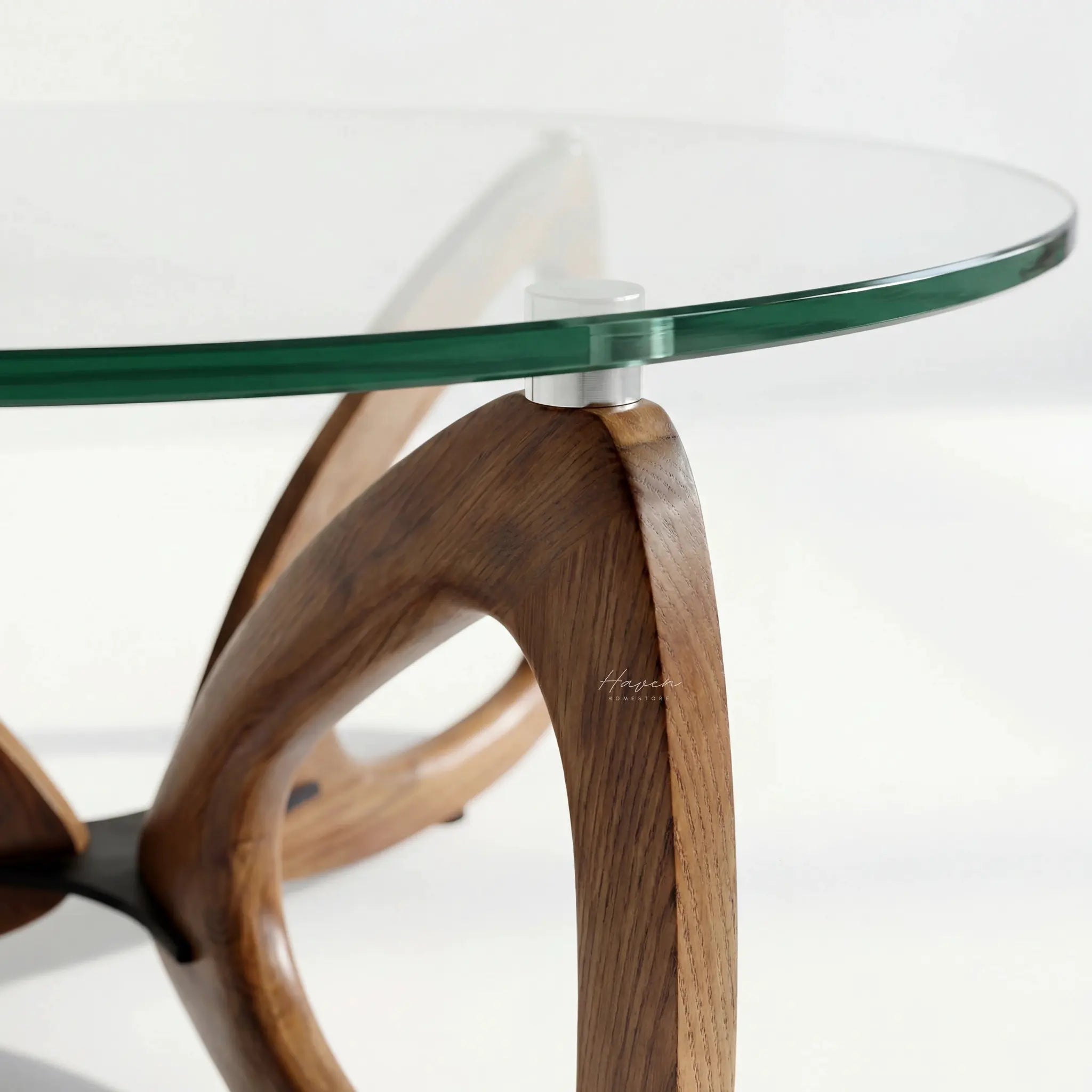Maddox Mid Century Coffee Table with curved ash base and glass top.