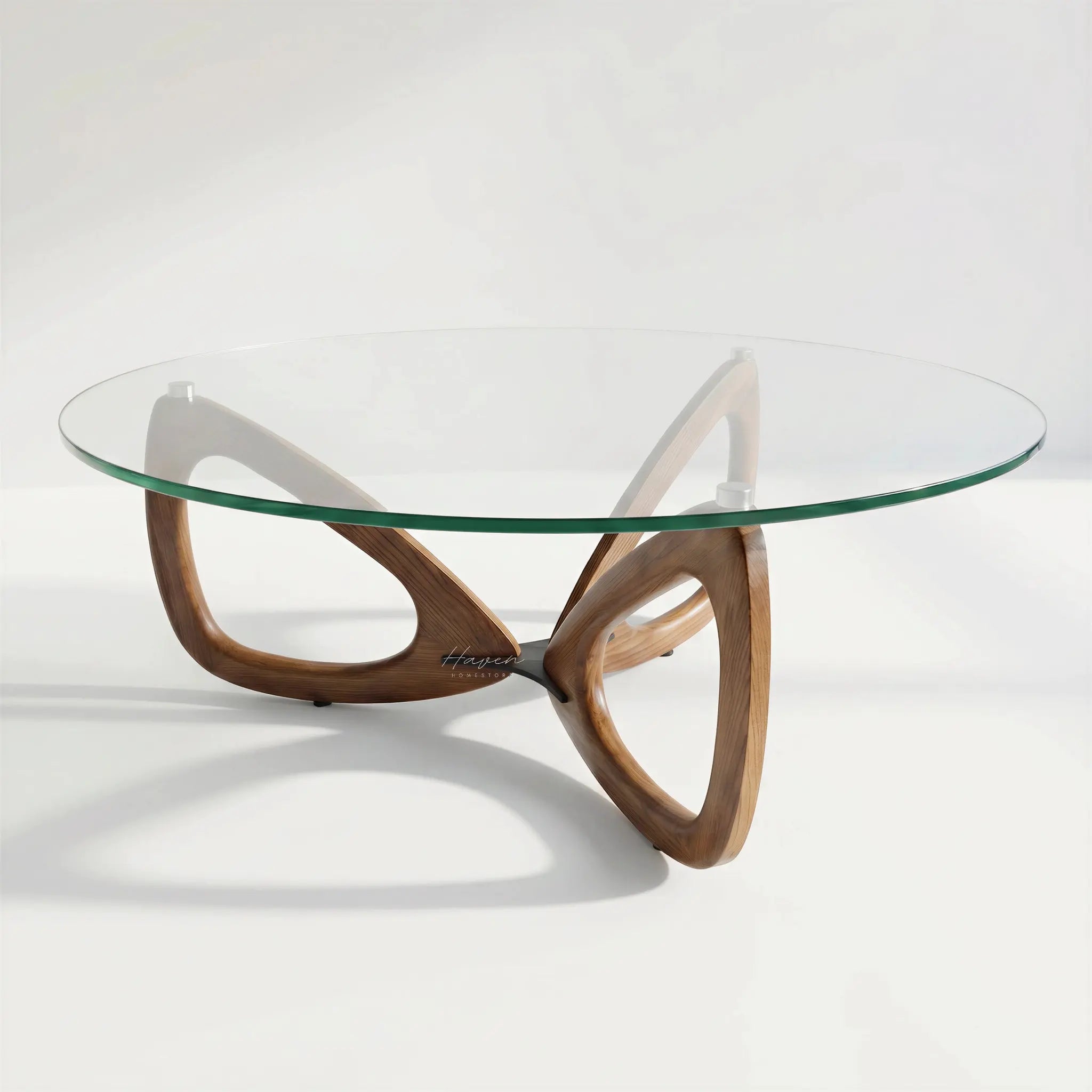 Maddox Mid Century Coffee Table with round glass top and sculptural ash base.
