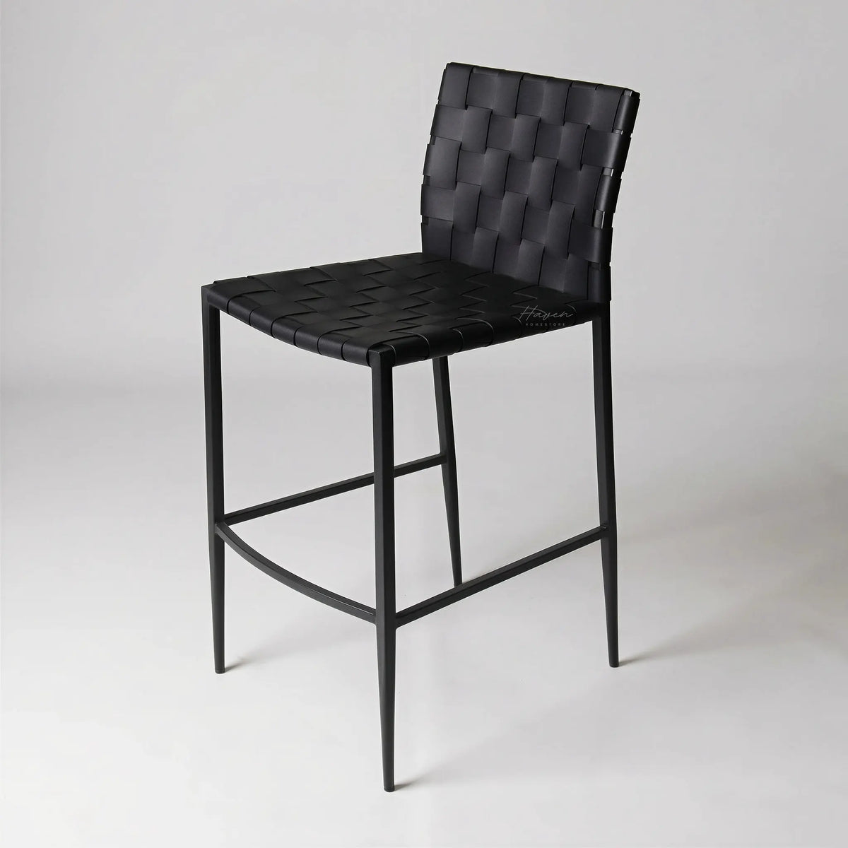 Calibri Counter Stool with black woven PU leather seat and slim powder-coated metal frame.