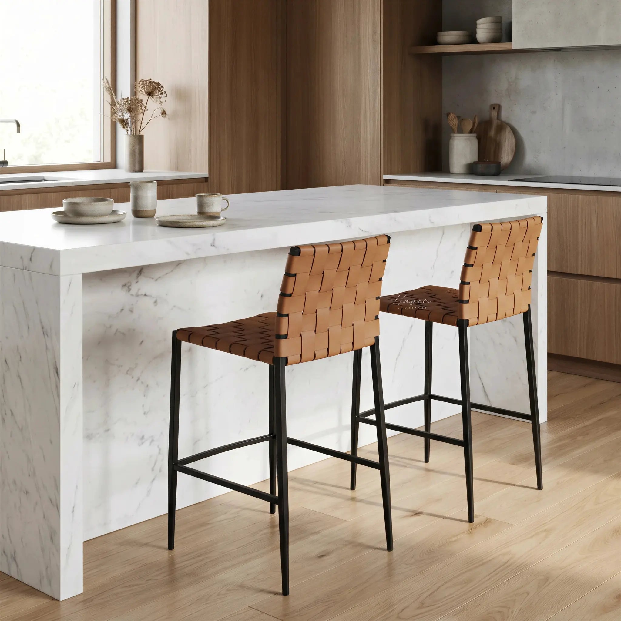 Calibri Counter Stool with a woven PU leather seat and slim powder-coated metal frame at a white marble kitchen island.