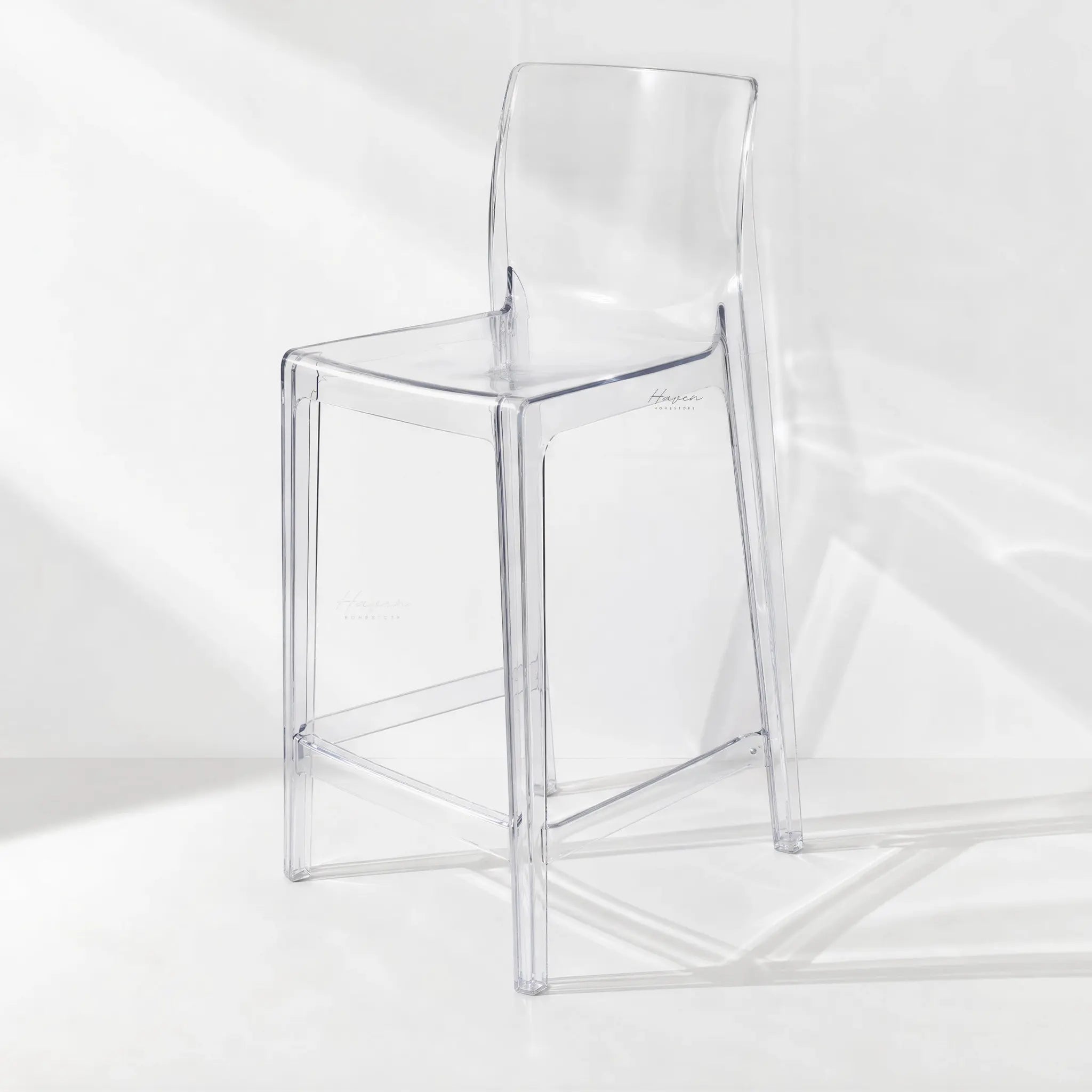Jupiter Counter Stool in clear polycarbonate; transparent design that lets light flow through.