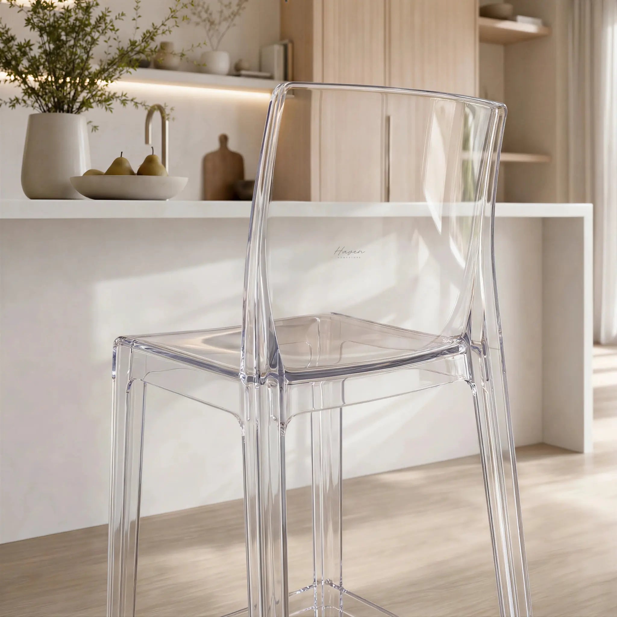 Jupiter Counter Stool in clear polycarbonate at a bright, minimal NZ kitchen island.