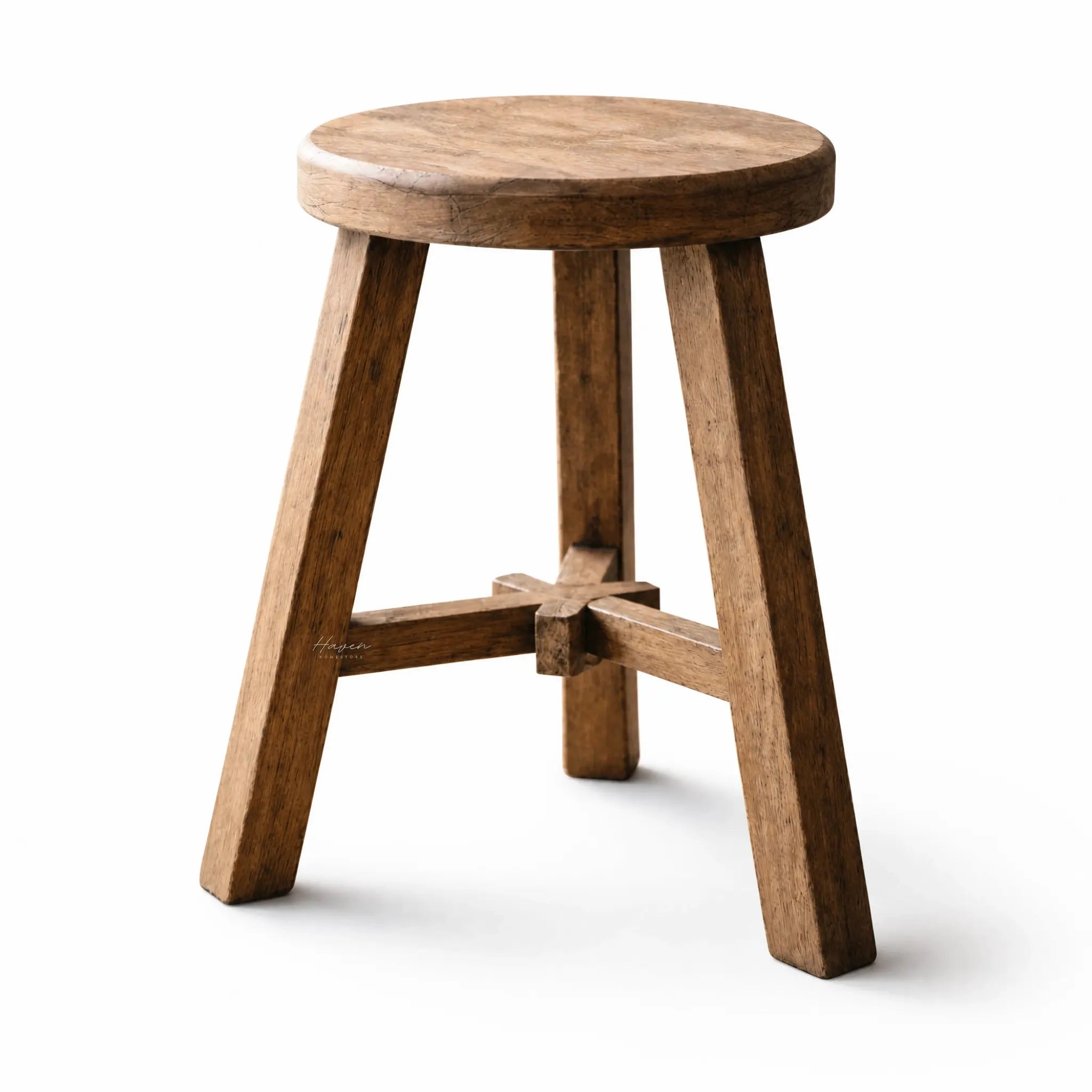 Rustico Stool crafted from reclaimed elm with weathered finish, round seat, showcasing grain variation and marks.