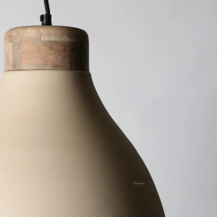 Scandi pendant light with an iron body and warm mango wood detail, showcasing a soft, inviting silhouette.